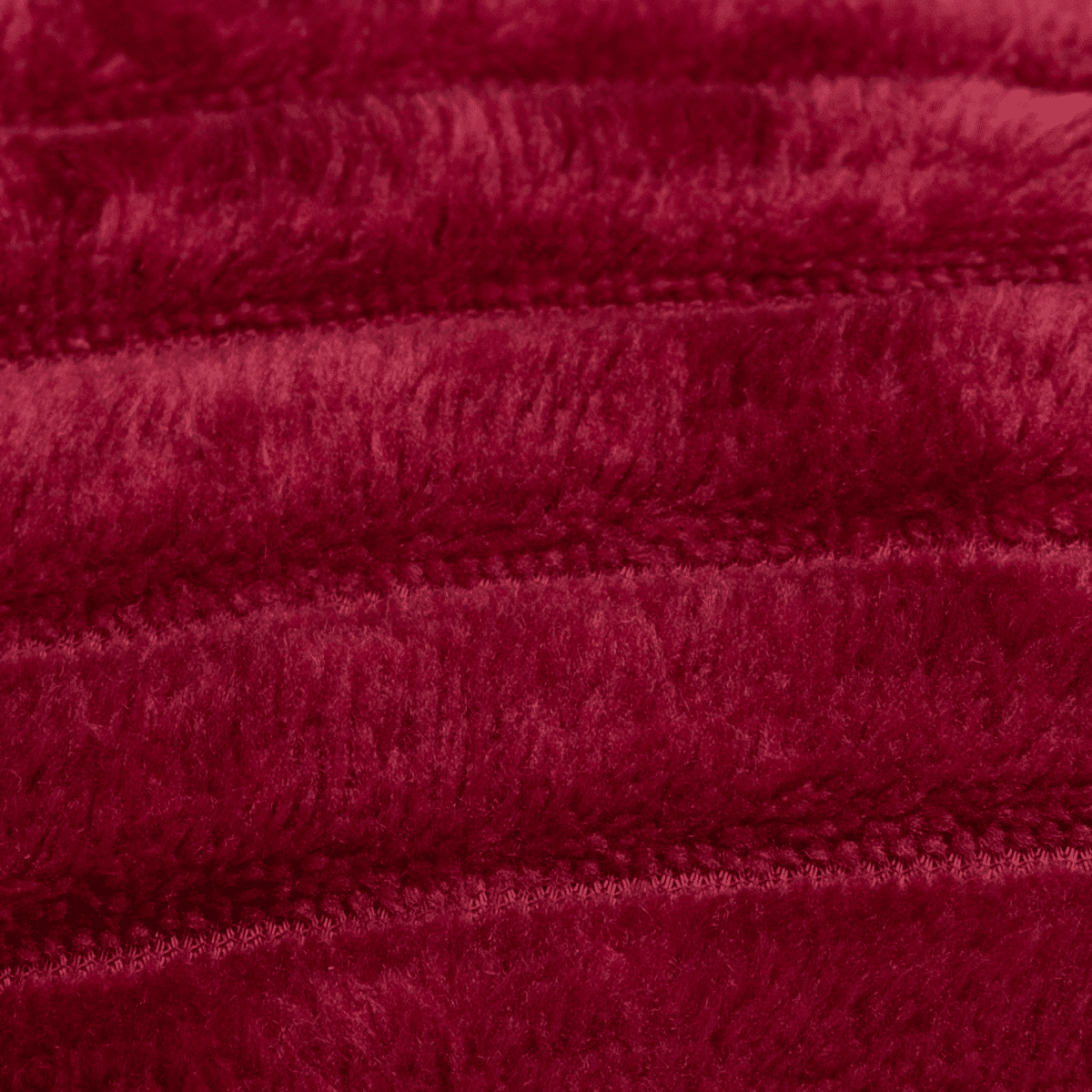 Close-up van zachte bordeauxrode fleece textuur van Boender Outdoor deken