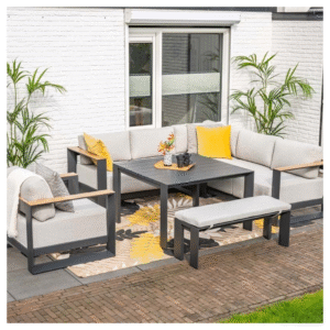Complete tuinset met hoekbank, tafel, bankje en losse stoel in moderne tuin